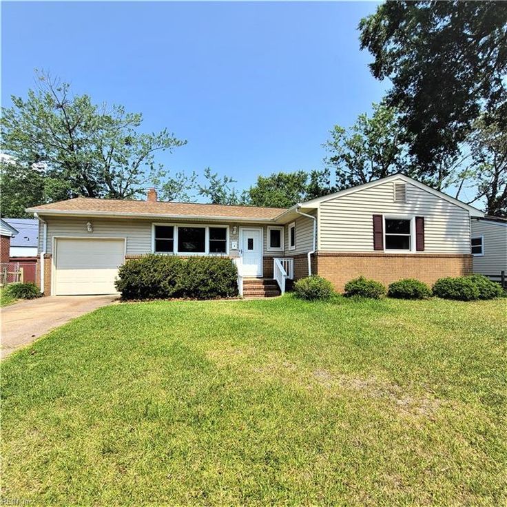 Small starter home with green lawn — typical FHA-eligible property
